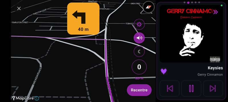 Drive mode: dark map with turn-by-turn directions and the passenger panel playing music